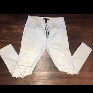 Woman’s forever 21 destroyed light wash jeans